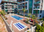 Nestled in lush gardens & scenic orchards, this brand new 1-bedroom apartment in Oba Alanya offers a tranquil retreat with modern amenities (1)