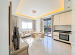This fully furnished modern 2-bedroom apartment for sale in Oba Alanya is located just 400 meters from the beach, offering the perfect blend of comfort and convenience (1)