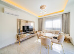 This fully furnished modern 2-bedroom apartment for sale in Oba Alanya is located just 400 meters from the beach, offering the perfect blend of comfort and convenience (2)